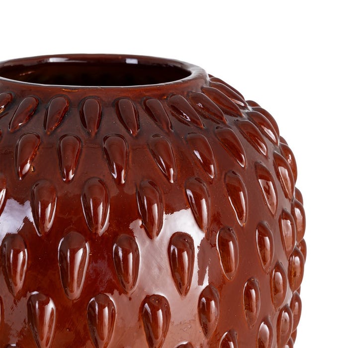 Textured terracotta ceramic vase, detail view